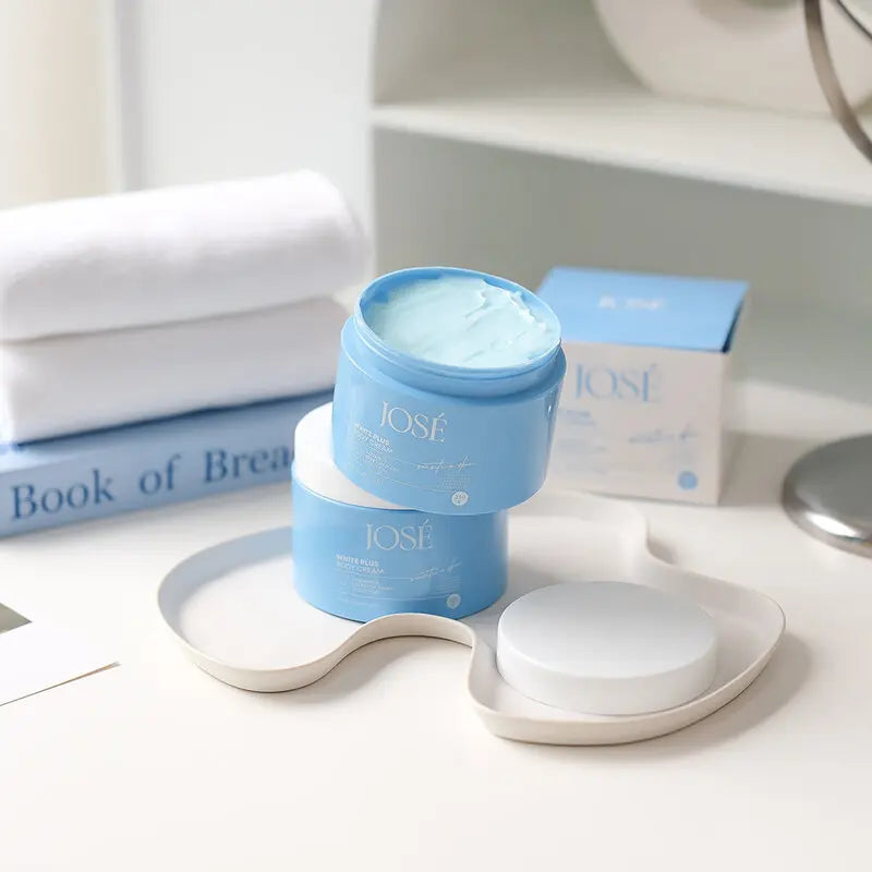 Blue skincare product containers with 'IOSE' branding on a white surface.