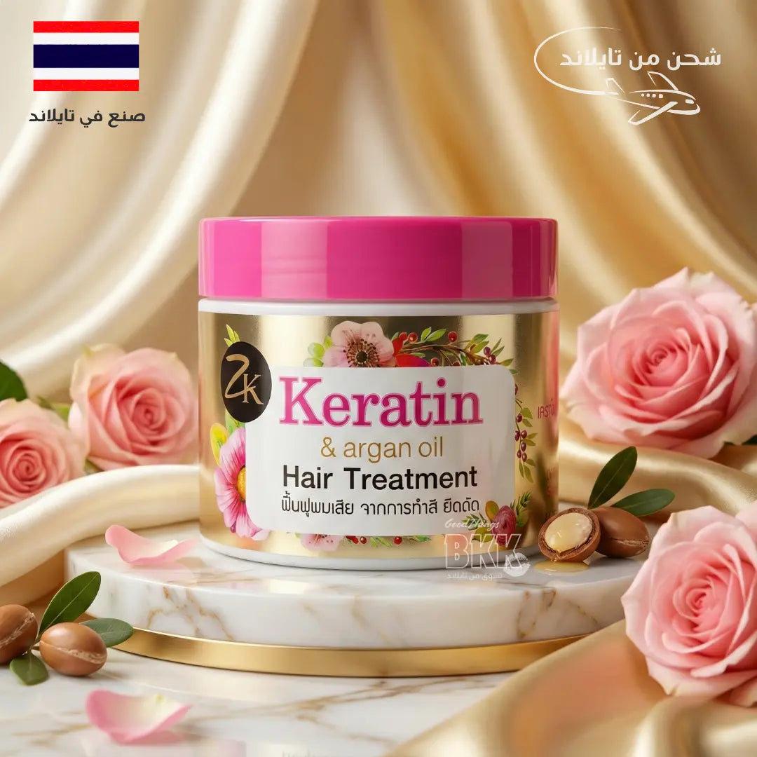 Keratin hair treatment jar with pink roses and argan oil nuts on a decorative background