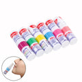 Set of colorful face wash bottles with a close-up of a person using one on their face.