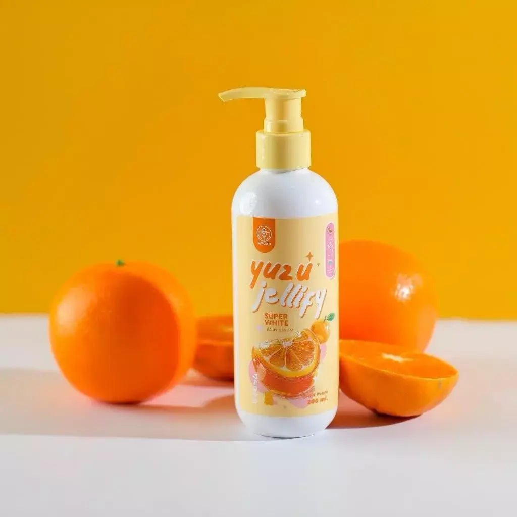 Yuzu jelly bottle with oranges on a yellow background